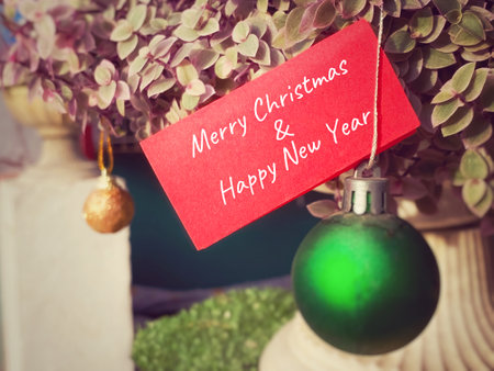 Merry Christmas and Happy New Year greeting card with vintage filter effectの写真素材