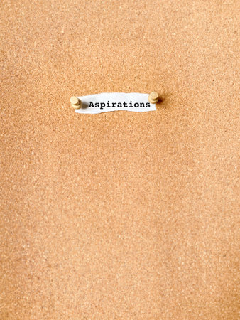 A piece of paper attached to a cork board with the inscriptionの写真素材