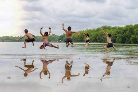 Many boys jumped into the river.