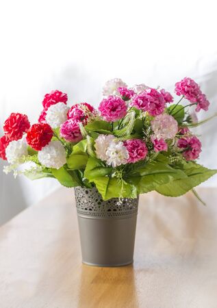 Bunch of artificial flowers on white backgroundの写真素材