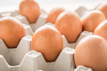 close up of eggs in paper tray