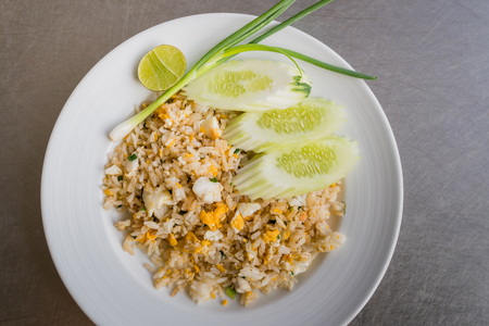 Crab meat fried rice on white plateの写真素材
