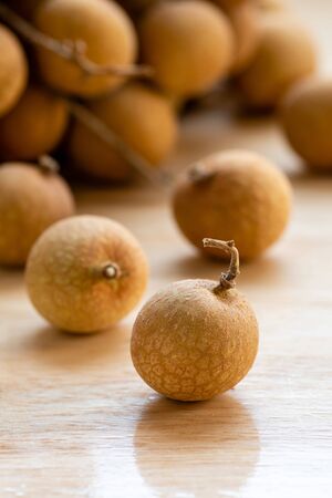 Top view close up of longan on wooden backgroundの写真素材