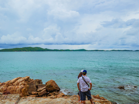 Rocky coast Beach seascape on idyllic ocean and Lover Couple stand on the Rocky,Khao Laem Ya nation park thailand,Holiday in summer conceptの写真素材