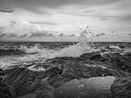 Ocean wave crashing Onto Rocky in the Blue ocean,Khao Laem Ya nation park Thailand,Black white Tone colorの写真素材