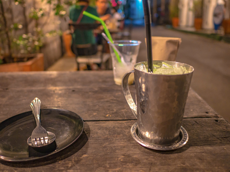 cutlery and ice milk on the wooden teble in restaurantの写真素材