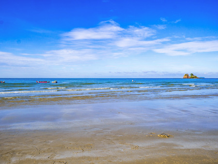 Tropical Idyllic ocean Blue sky and beautiful sand on the beach in vacation time,Holiday on the beach,Summer concept.Thailandの写真素材