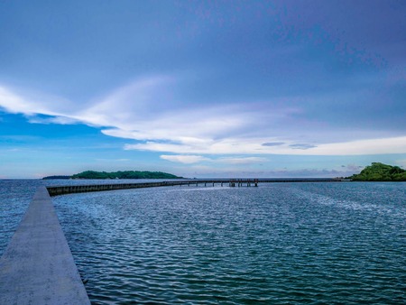 Concrete bridges on the ocean with idyllic ocean and beautiful Sky in vacation time,Holiday in the sea,Summer conceptの写真素材