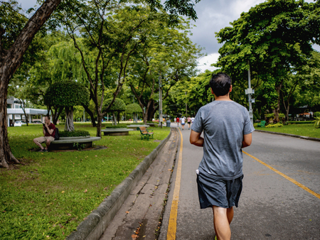 Asian runner Jogging in the city central park,running conceptの写真素材