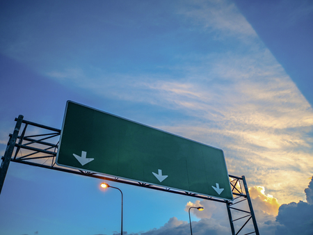 Big Traffic guide post on top of the road with idyllic sky and white cloud in the city,mock upの写真素材