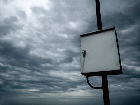Electronic control on rainy cloud skyの写真素材