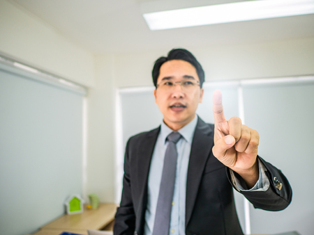 Business man point his fingerの写真素材