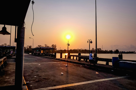 Beautiful Sunrise sky on boat harbor in the morningの写真素材