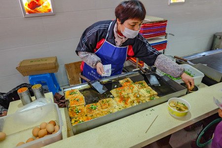 Shanghai/Thailand - January 23 2015:Street food in Bus stop from the long way from shang hai city to yiwu cityのeditorial素材