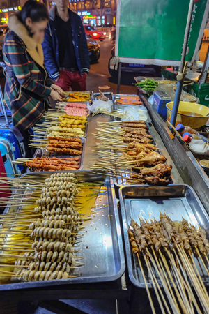 Delicious Street food Shop in yiwu night market zhejiang chinaの写真素材