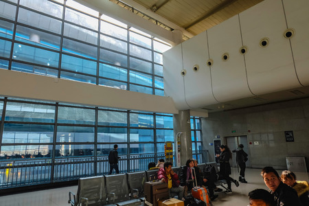 yiwu/China - January 24 2015: Chinese people wait for the rocket train to go to another city in Yiwu Train station,yiwu city zhejiang chinaのeditorial素材