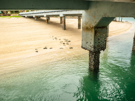 Idyllic beach and beautiful Green water sea  under the stone harbor in Samae San Island Thailandの写真素材