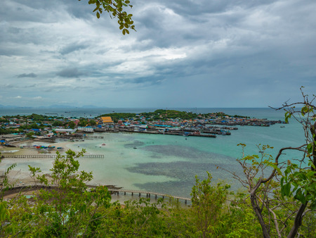 ViewPoint on the mountain with Fisherman townscape with idyllic ocean and rainy cloud sky in vacation time,Chonburi thailand,holiday conceptの写真素材