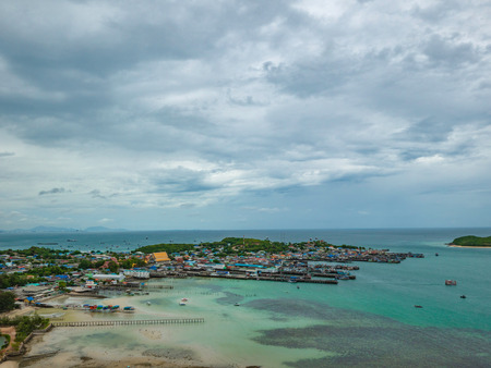 ViewPoint on the mountain with Fisherman townscape with idyllic ocean and rainy cloud sky in vacation time,Chonburi thailand,holiday conceptの写真素材