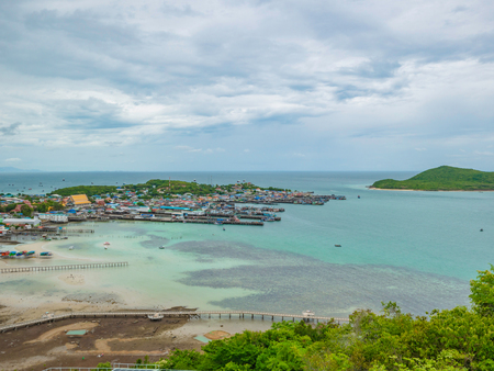 ViewPoint on the mountain with Fisherman townscape with idyllic ocean and rainy cloud sky in vacation time,Chonburi thailand,holiday conceptの写真素材