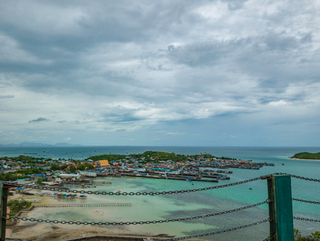 ViewPoint on the mountain with Fisherman townscape with idyllic ocean and rainy cloud sky in vacation time,Chonburi thailand,holiday conceptの写真素材