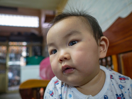 Cutie handsome asian Boy baby smile very happy in the houseの写真素材