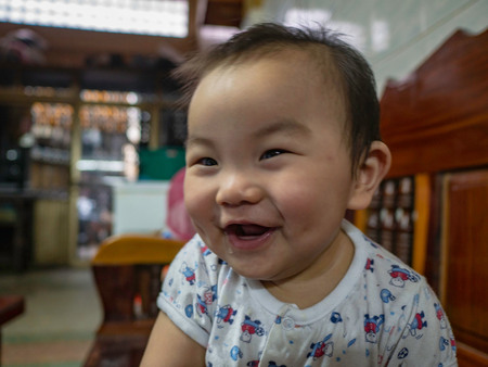 Cutie handsome asian Boy baby smile very happy in the houseの写真素材