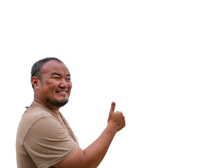 Asisn Fat Guy make a thumb up pose and funny face or serious on isolated backgroundの写真素材