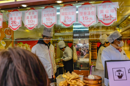 Shanghai/China -  January 25 2015:Unidentified Chinese Chef Cook and trade traditional food at Yuyuan Garden in Old City area in Shanghai Chinaのeditorial素材