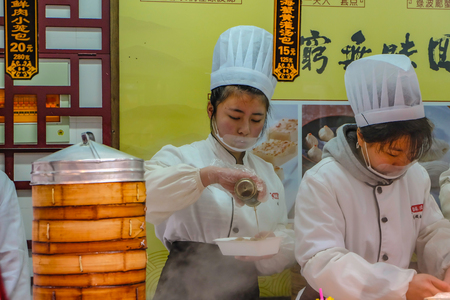 Shanghai/China -  January 27 2015:Unidentified Chinese Chef Cook and trade traditional food at Yuyuan Garden in Old City area in Shanghai Chinaのeditorial素材