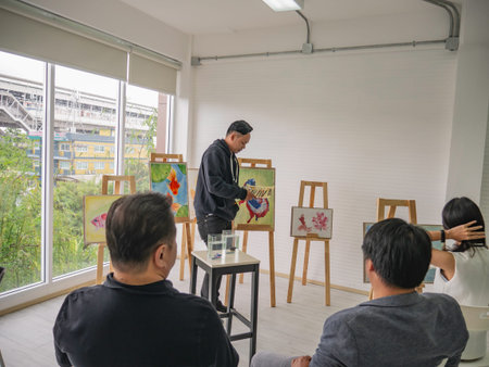 Handsome Young Asian man or water color artist Teaching how to paint in studio,fish concept