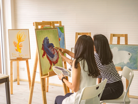 Two young asian woman artist dawning while useing ideas to think and create the best artwork together,fish conceptの写真素材