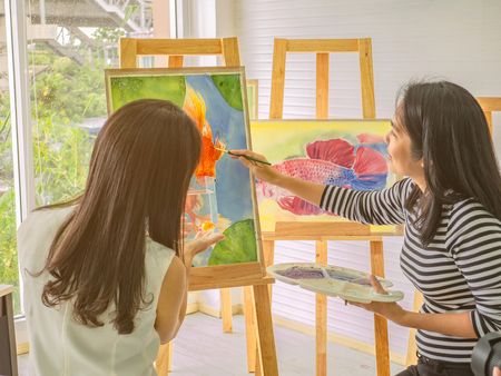 Two young asian woman artist dawning while useing ideas to think and create the best artwork together,fish conceptの写真素材