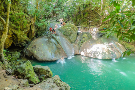 Kanchanaburi/thailand- November 21 2016 : Unacquainted Tourist Playing natural water fall slider in erawan waterfall natiaonal park kanchanaburi ,thailand travelのeditorial素材