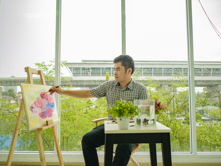 Asian watercolor artist focus drawing fish ,fish and art conceptの写真素材