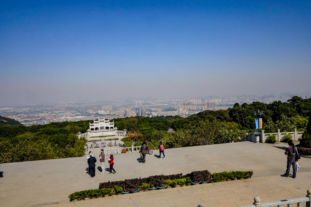 Foshan/China-27 November 2015:View on top in xiqiao mountain park with foshan cityscape in Chinaのeditorial素材