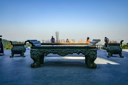 Foshan/China - 27 November 2015:Big Joss stick Pots with Touriest prayer in Guanyin of Mount Xiqiao Temple,Foshan city Chinaのeditorial素材