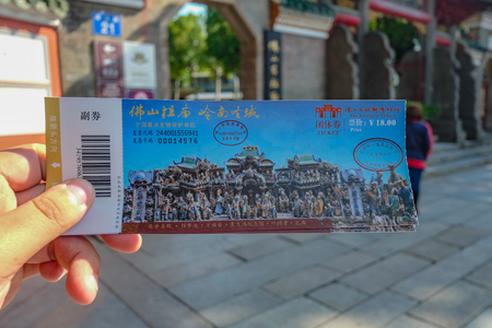 Foshan/China - 27 November 2015: Tourist hold The ticker of "The Ancestral temple" in foshan city chinaのeditorial素材