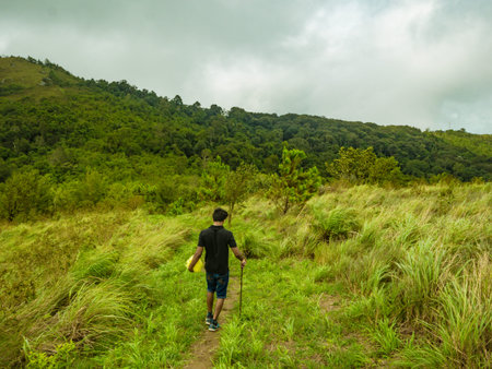 Back of Trekker walk in Khao Luang mountain  in Ramkhamhaeng National Park,Sukhothai province...