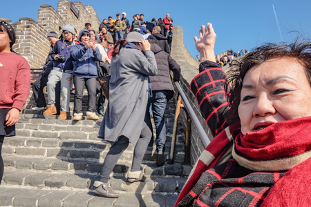beijing/China - 27 February 2017:Portrait photo of Senior asian women with Unacquainted Chinese people or tourist walking in Great Wall of China at Beijing City. 7 Wonders of the Worldのeditorial素材