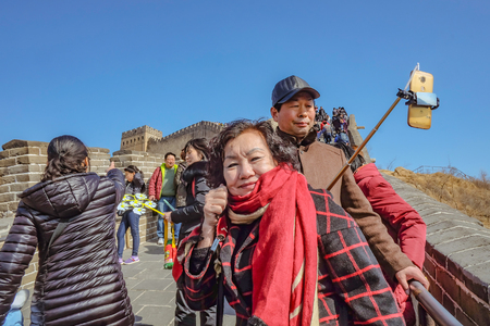 beijing/China - 27 February 2017:Portrait photo of Senior asian women with Unacquainted Chinese people or tourist walking in Great Wall of China at Beijing City. 7 Wonders of the Worldのeditorial素材