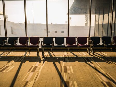 Airport chair beside the window in the morning at don muang internation airport bangkok City Thailandの写真素材