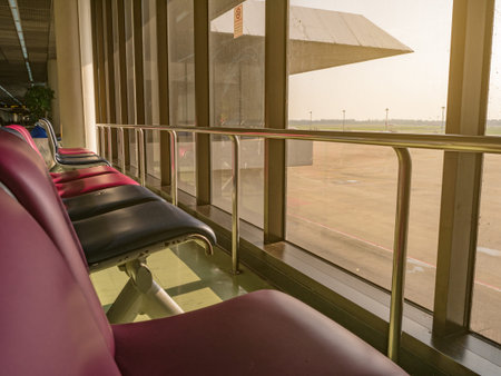 Airport chair beside the window in the morning at don muang internation airport bangkok City...