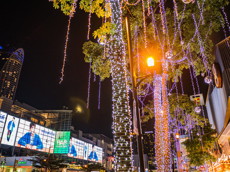 Bangkok/Thailand - 13 December 2018:Small neon light Wrap around and Hang on the Tree in front of Gaysorn Department Store at Bangkok city Thailandのeditorial素材