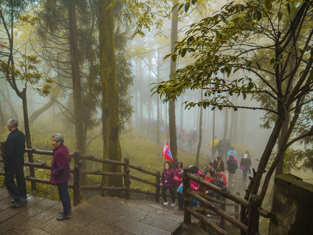 zhangjiajie/China - 14 October 2018: Unacquainted Tourists Walking in helong park on tianzi mountain at Zhangjiajie National Forest Park in Wulingyuan District Zhangjiajie City China in the Foggy day.のeditorial素材