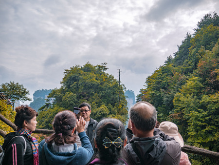 zhangjiajie/China - 14 October 2018: Unacquainted Tourists  on tianzi mountain in Zhangjiajie National Forest Park in Wulingyuan District Zhangjiajie City China in the Foggy day.のeditorial素材