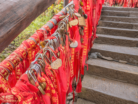 zhangjiajie/China - 14 October 2018: Red Blessing ribbon on Tianxiadiyiwei nature bridge tianzi mountain in Zhangjiajie National Forest Park in Wulingyuan District Zhangjiajie City China.のeditorial素材