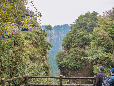zhangjiajie/China - 14 October 2018: Unacquainted Tourists Walking on tianzi mountain in Zhangjiajie National Forest Park in Wulingyuan District Zhangjiajie City China in the Foggy day.のeditorial素材