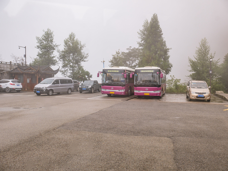 zhangjiajie/China - 14 October 2018:Bus and Taxi car on the Tianzi mountain in Zhangjiajie National Forest Park in Wulingyuan District Zhangjiajie City China in the Foggy day.のeditorial素材