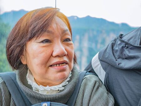 Portrait Senior asian women in "bailong elevator" on Zhangjiajie National Forest Park in Wulingyuan District Zhangjiajie City Chinaの写真素材